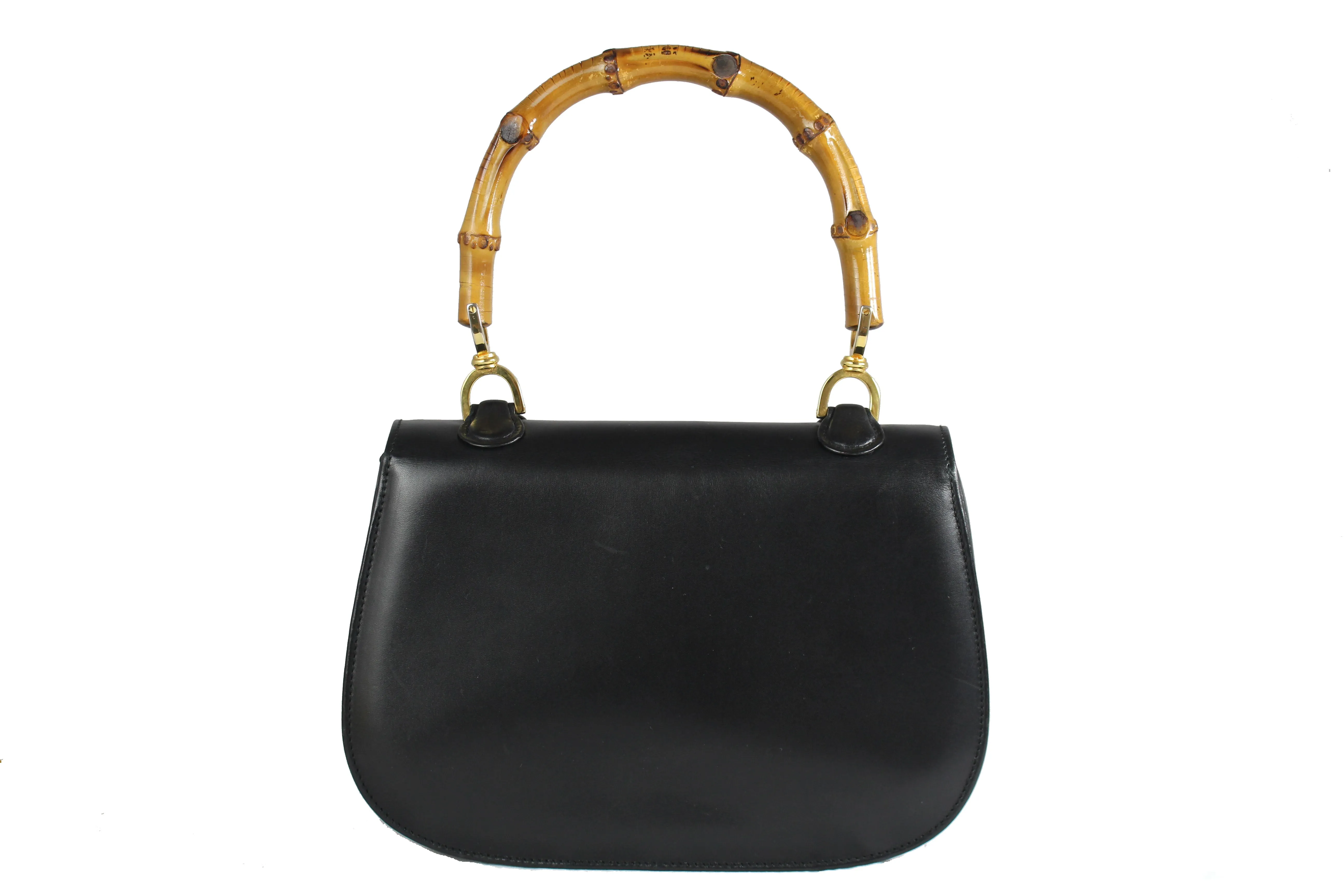 Black leather handbag with bamboo handle and lock